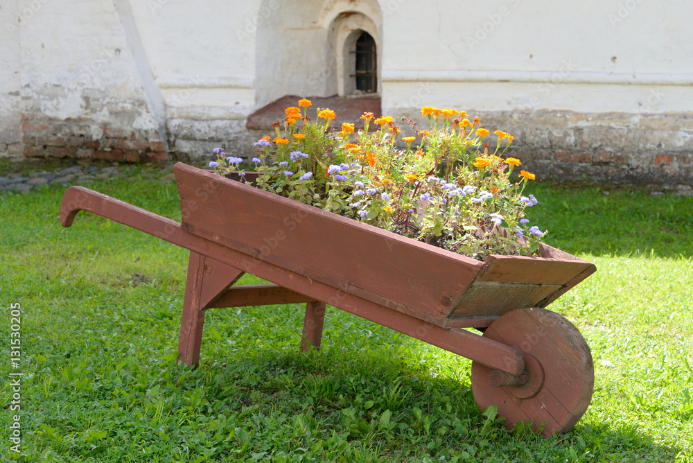 Wooden cart with flowers.