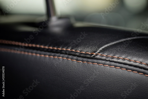 Car interior detail. Leather seat part. Macro.
