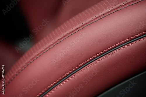 Car leather seat material with stich. Macro photo.