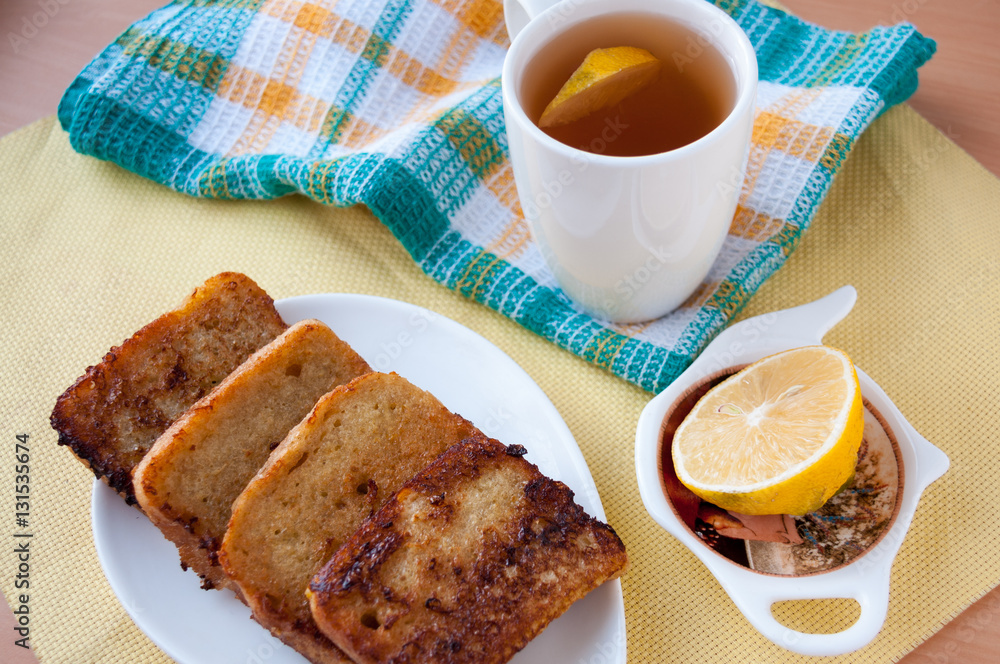 Breakfast: tea with lemon and fried bread Breakfast: tea with lemon and fried bread