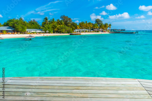 Fototapeta Naklejka Na Ścianę i Meble -  Wooden planks in tropical Maldives island and beauty of the sea
