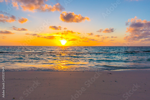 Beautiful sunset with sky over calm sea in tropical Maldives is © jannoon028