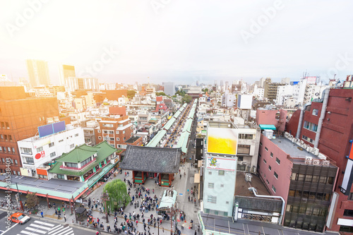 Business and culture concept - panoramic modern city skyline bird eye aerial view with Sensoji-ji Temple shrine - Asakusa district under dramatic sunrise and morning blue sky in Tokyo, Japan © voyata