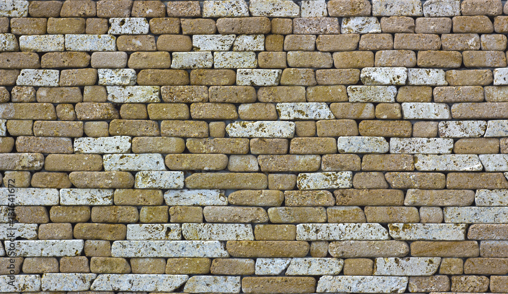 Fototapeta premium yellow natural stone facade, wall tiles