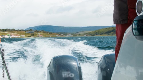 Boat Ride in the Beagle Channel with the Historical Estancia Haberton Farm in Tierra del Fuego in the Background photo
