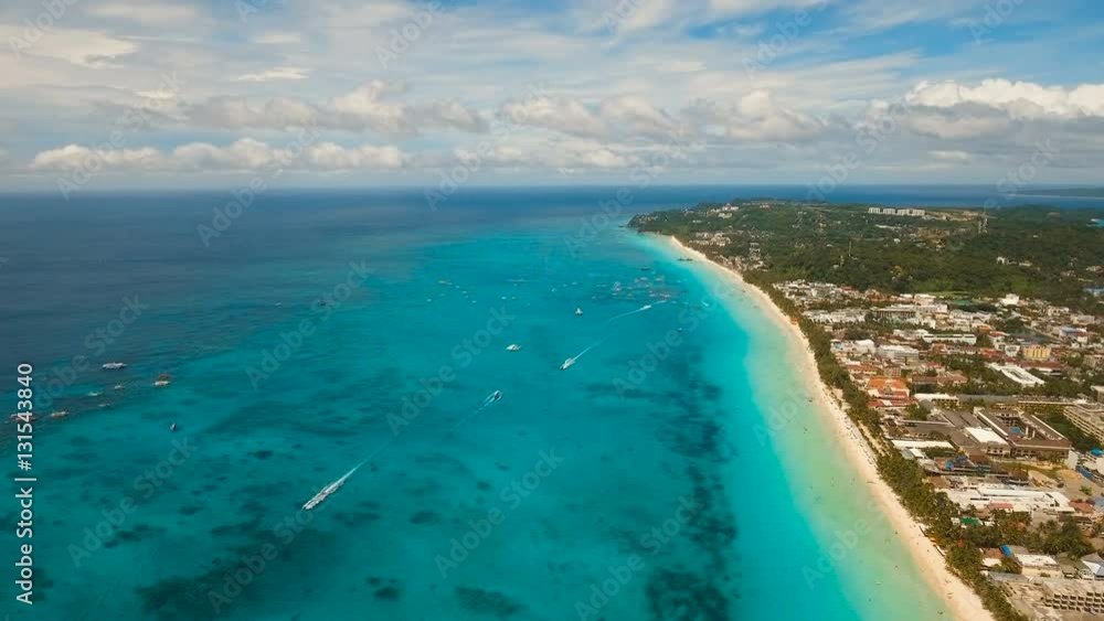 Aerial view of beautiful tropical island with white sand beach, hotels and tourists. Tropical lagoon with turquoise water and white sand. Beautiful sky, sea, beach, resort. Beautiful tropical beach of Aerial view of beautiful tropical island with white sand beach, hotels and tourists. Tropical lagoon with turquoise water and white sand. Beautiful sky, sea, beach, resort. Beautiful tropical beach of
