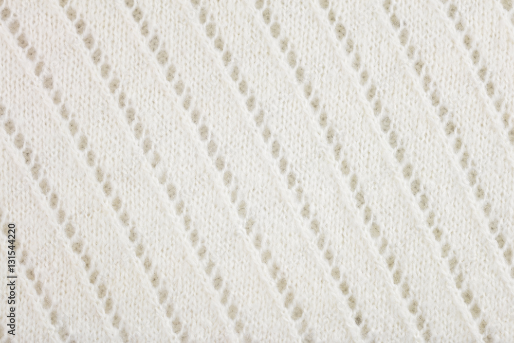 White woolen knitted fabric background White woolen knitted fabric background