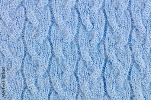Light Blue woolen knitted ornamented fabric background