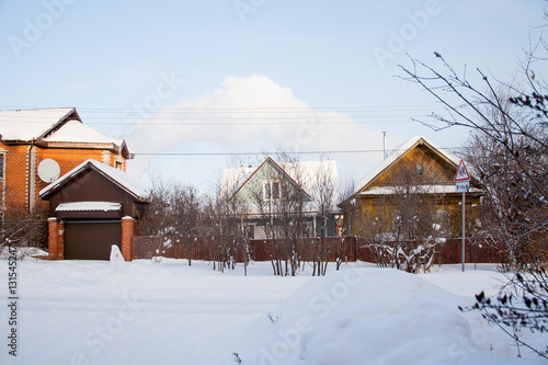 Winter rural landscape with private houses