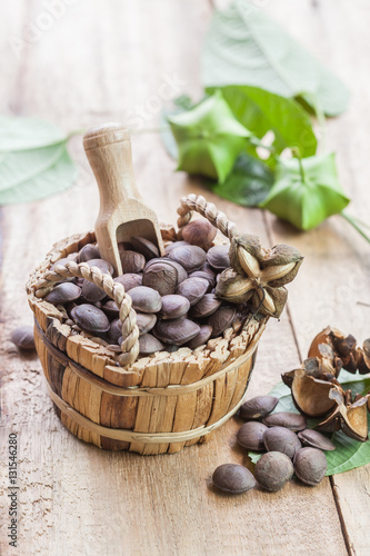 Fototapeta Naklejka Na Ścianę i Meble -  dried capsule seeds fruit of Sacha Inchi peanut in basket