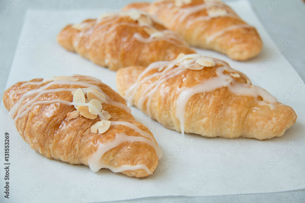  almond croissant on white paper