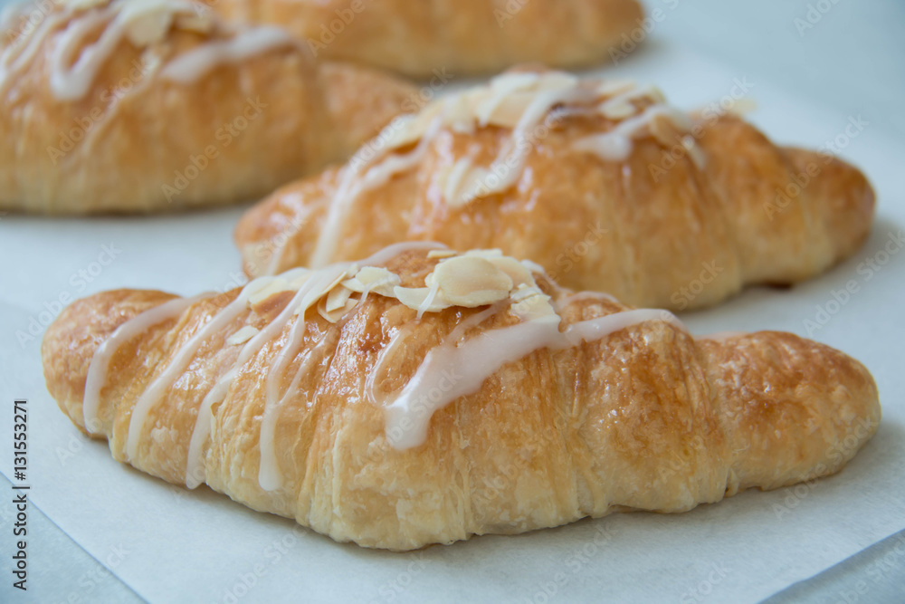  almond croissant on white paper