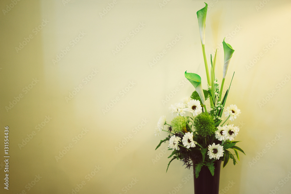 Vase of flowers on the white background.