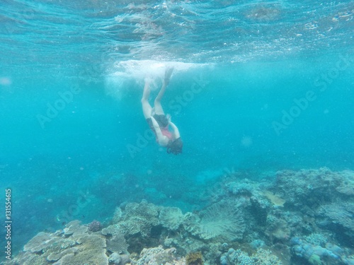 Snorkeler diving under © sewu