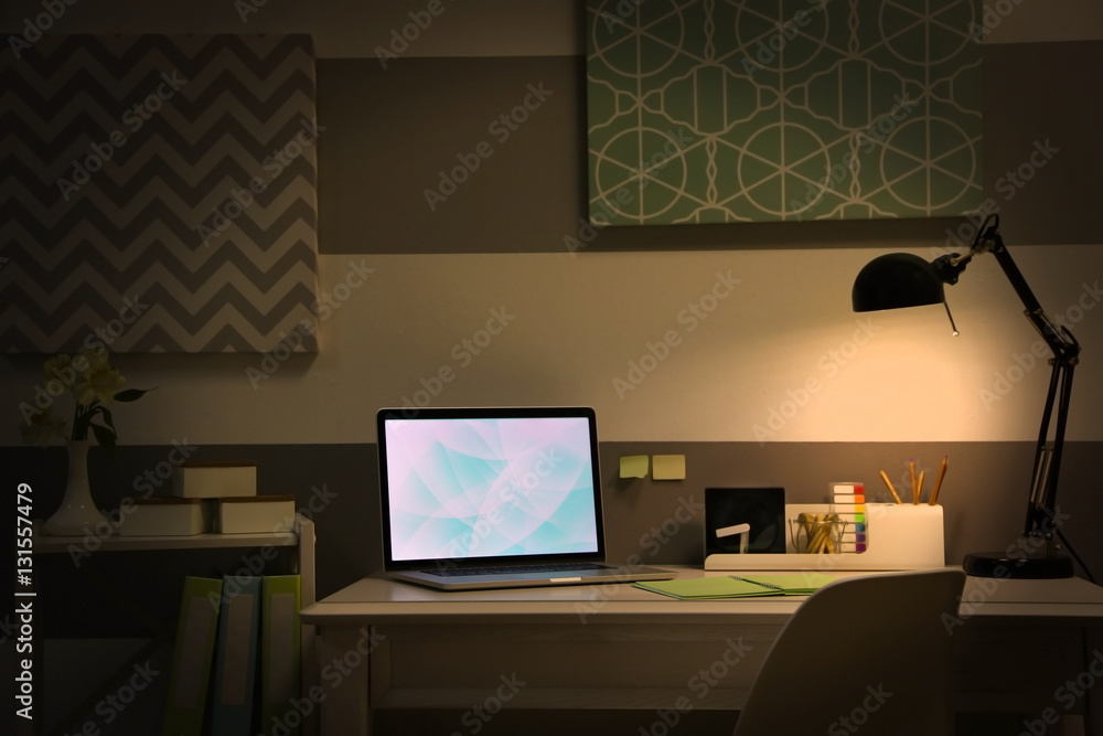 Stylish workplace with laptop at home Stylish workplace with laptop at home