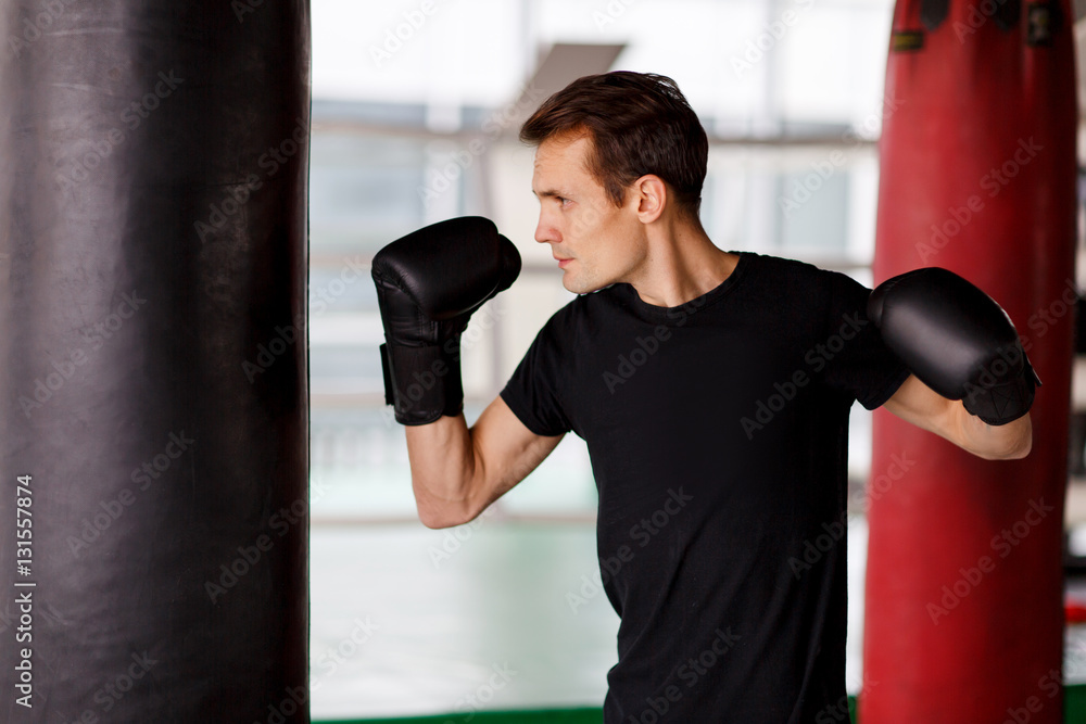 Male engaged in boxing gloves