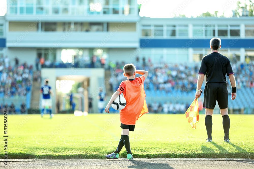 Fototapeta premium Football match in sunny summer day