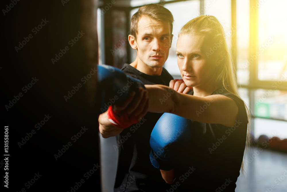 Woman practicing boxing in gym