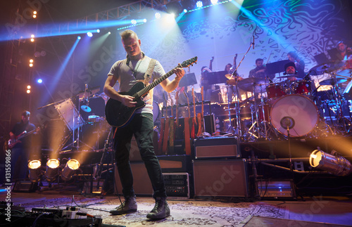 The guitarist plays solo.