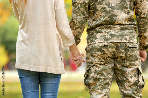 Soldier reunited with wife,  closeup