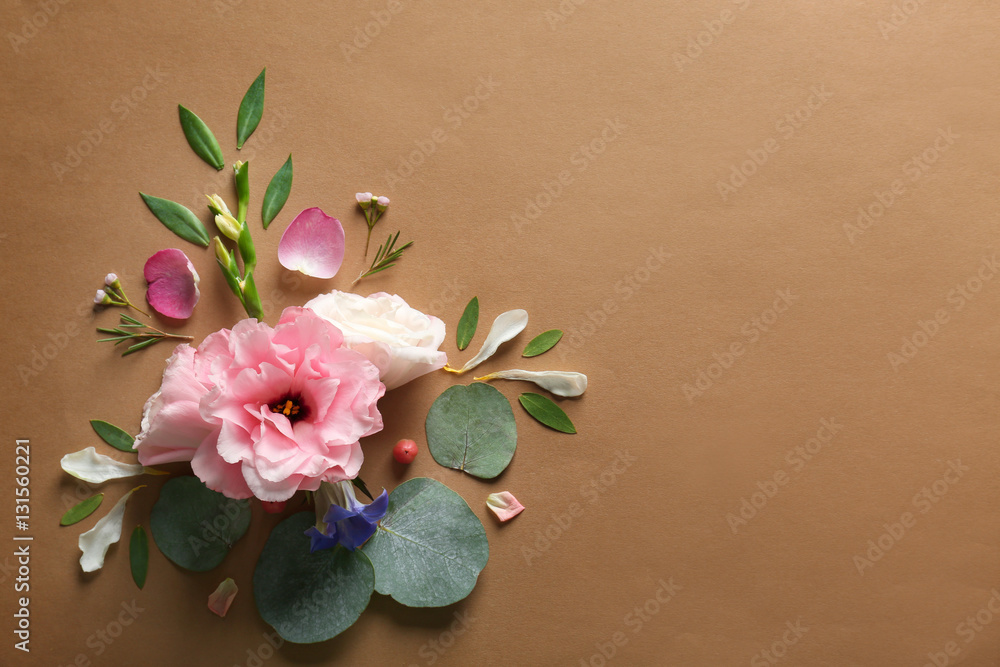 Composition of flowers and leaves on color background