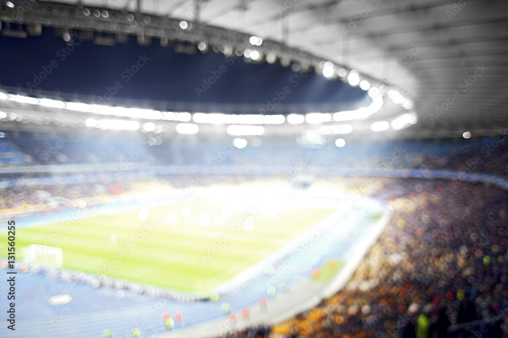 Panoramic view of modern stadium during football match, blurred background