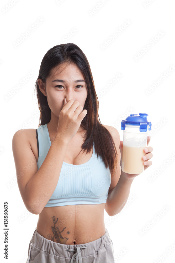 Beautiful Asian healthy girl hate whey protein smell. Beautiful Asian healthy girl hate whey protein smell.