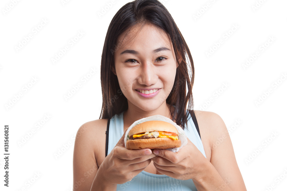 Beautiful Asian healthy girl enjoy eating hamburger. Beautiful Asian healthy girl enjoy eating hamburger.