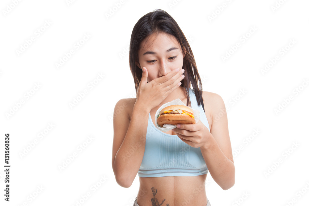 Beautiful Asian healthy girl enjoy eating hamburger. Beautiful Asian healthy girl enjoy eating hamburger.