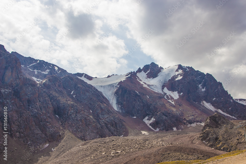 Fototapeta premium Snow-covered peaks behind Talgar Pass in Tien Shan mountains, Al