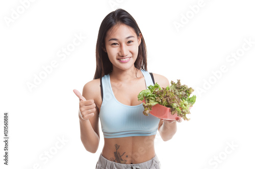 Beautiful Asian healthy girl thumbs up with salad. © halfbottle