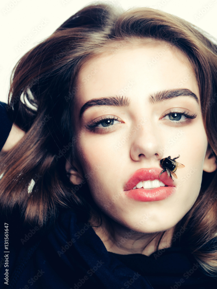 Fototapeta premium sexy girl with bee on red lips