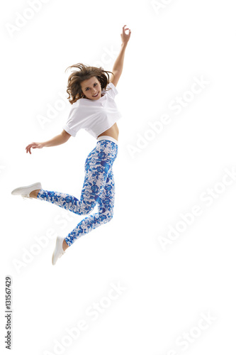 Young sexy dancer jumping gracefully in studio