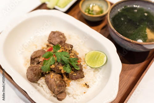 fried diced lamb with garlic and black pepper served with jasmine rice and clear soup