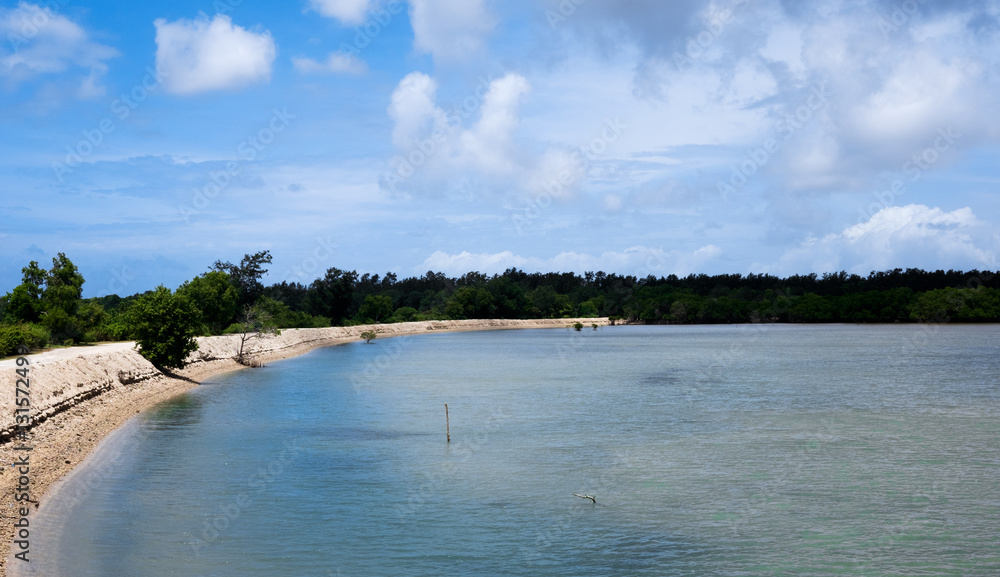 Water impoundment with artificial shores and embankment