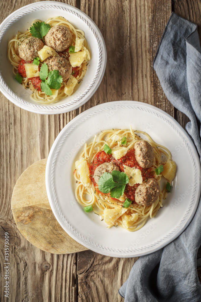 Ready-made spaghetti. meatballs and napkin at the board Ready-made spaghetti. meatballs and napkin at the board