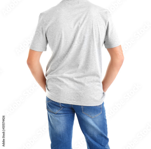 Handsome young man in blank grey t-shirt on white background, close up