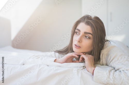 woman have fine on her bedroom. Young lady enjoying her morning and wake up.