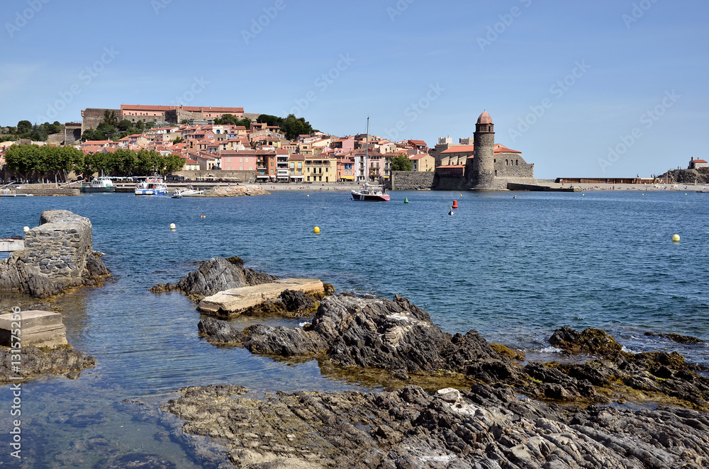 Coast of Collioure with the town and the fortifications in the background, commune on the côte vermeille in the Pyrénées-Orientales department, Languedoc-Roussillon region, in southern France.
