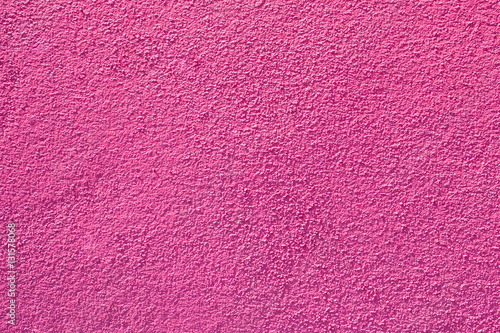 Pink painted rough wall texture.