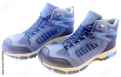 New trekking shoes isolated on white background closeup