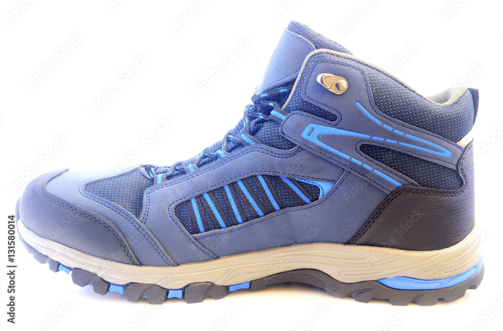 New trekking shoe isolated on white background closeup New trekking shoe isolated on white background closeup