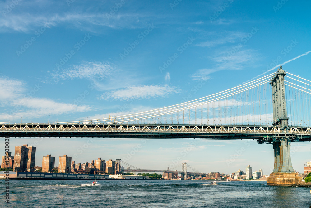 Naklejka premium Brooklyn Bridge in New York City at sunset. Vivid splittoned image.