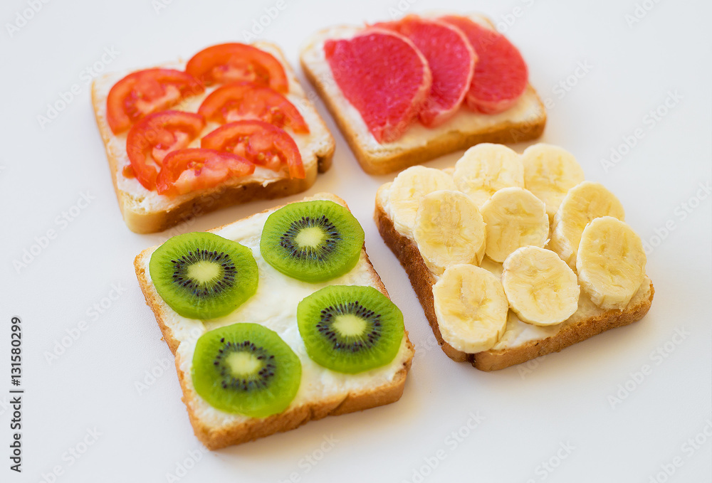 bright mix of sandwiches for breakfast (fruit, vegetables) bright mix of sandwiches for breakfast (fruit, vegetables)