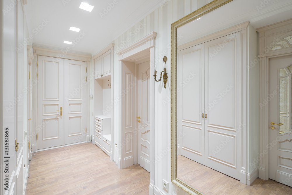 Fototapeta premium Hall in the flat. Wooden design, white colors. Wooden floor.