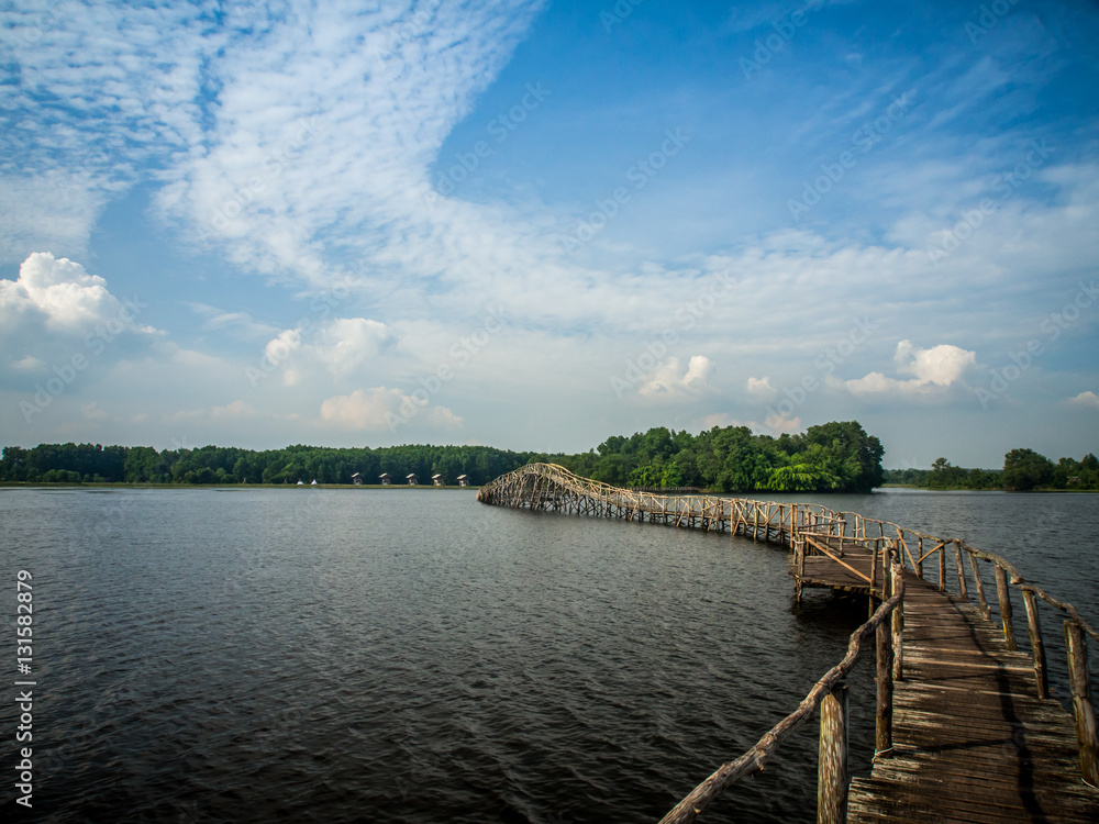 wood bridge bring to the little island in the lagoon