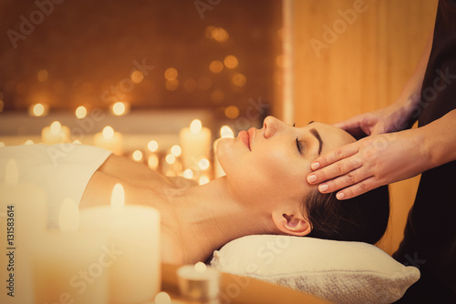 Professional masseuse undergoing head massage