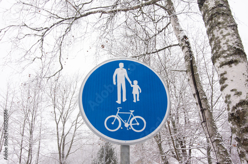 Bicycle and pedestrian lane road sign on pole post.