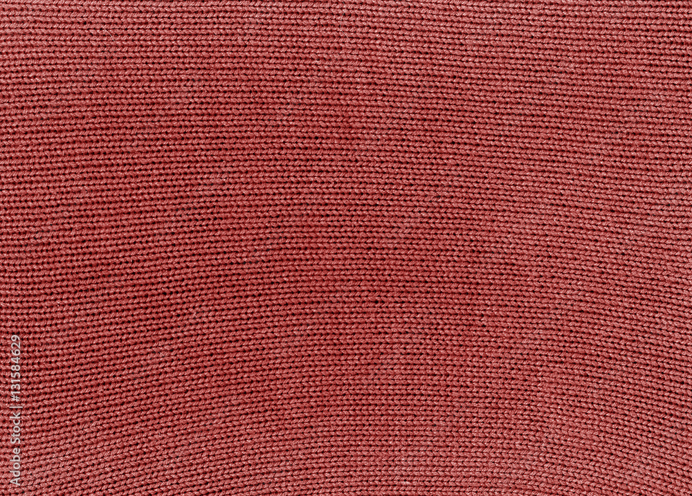 Fototapeta premium Red knitted material texture.