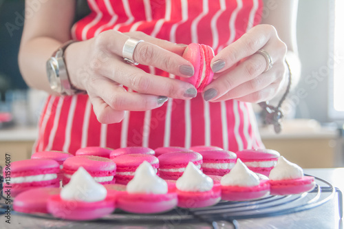 baker is making homemade macarons
